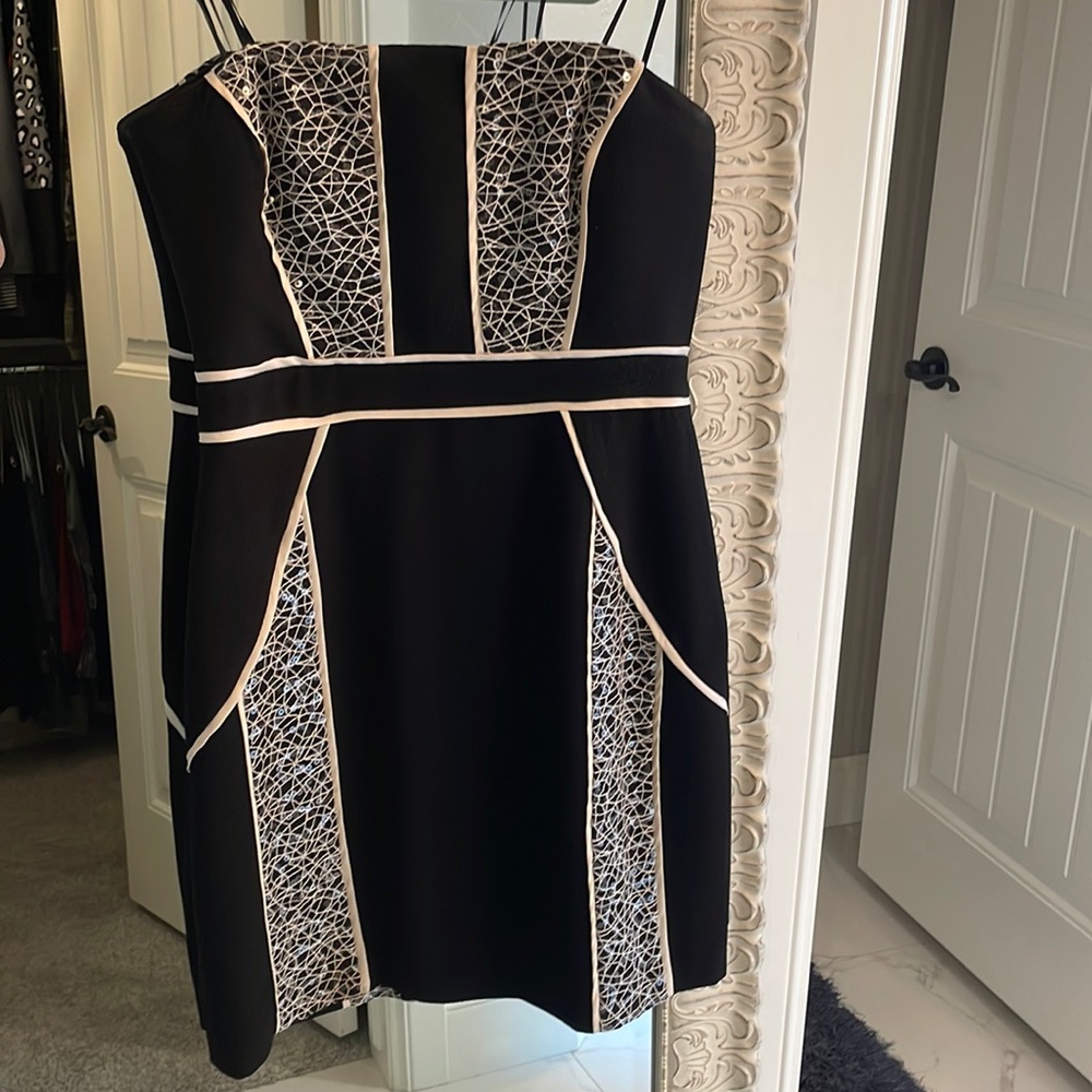 Cocktail size 4 black with pearl sequins. Never worn